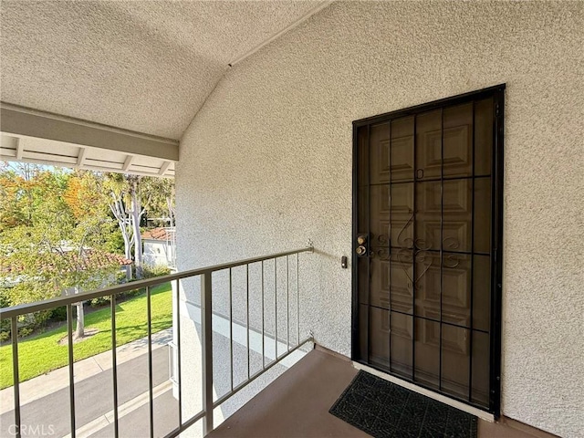 680 Via Alhambra Unit O, Laguna Woods, CA 92637 - property entrance featuring stucco siding and a balcony