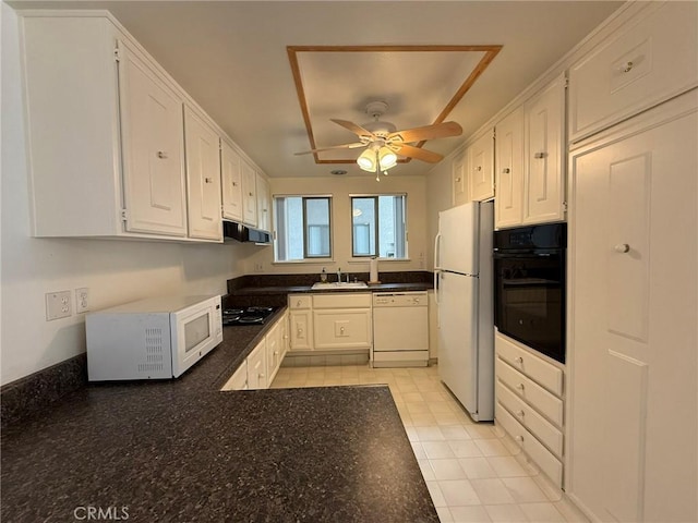 680 Via Alhambra Unit O, Laguna Woods, CA 92637 - kitchen with black appliances, extractor fan, white cabinets, and ceiling fan