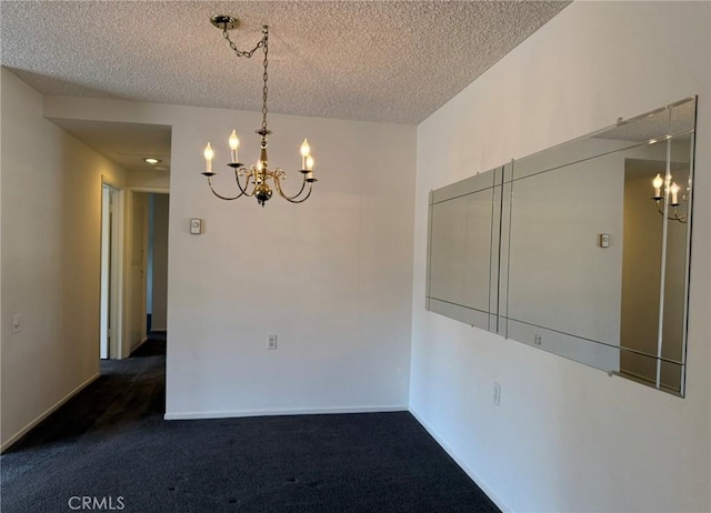 680 Via Alhambra Unit O, Laguna Woods, CA 92637 - unfurnished room featuring a chandelier, a textured ceiling, dark carpet, and baseboards