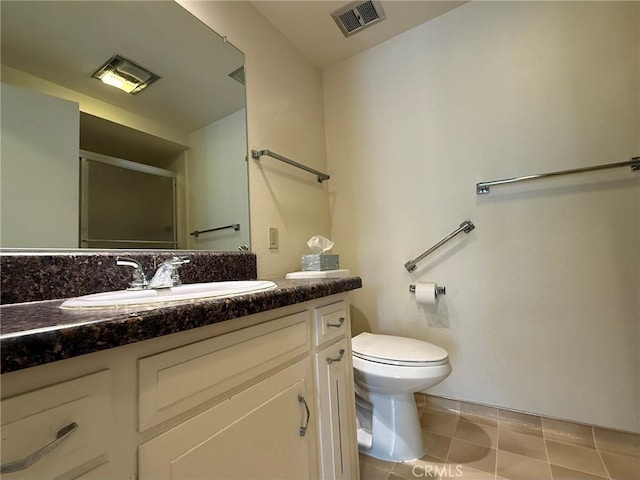 680 Via Alhambra Unit O, Laguna Woods, CA 92637 - bathroom with vanity, toilet, an enclosed shower, and tile patterned floors