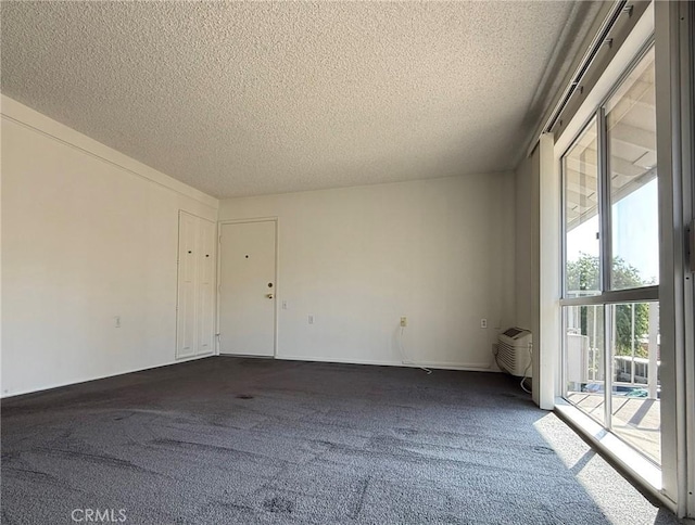 680 Via Alhambra Unit O, Laguna Woods, CA 92637 - empty room with a textured ceiling and dark colored carpet