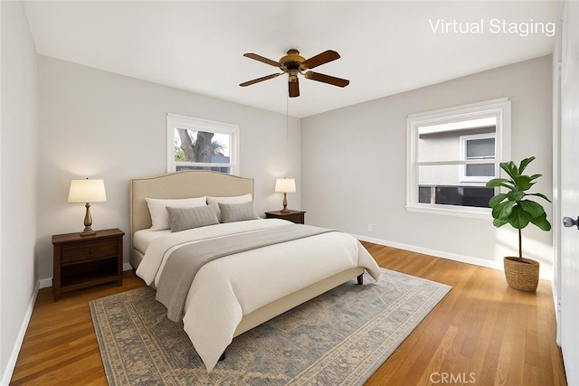 14124 Sayre St, Sylmar, CA 91342 - bedroom featuring wood finished floors, baseboards, and a ceiling fan