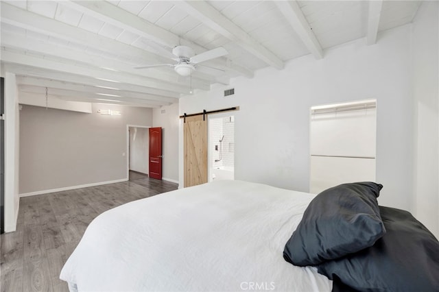14124 Sayre St, Sylmar, CA 91342 - bedroom with a barn door, beamed ceiling, wood finished floors, a ceiling fan, and baseboards