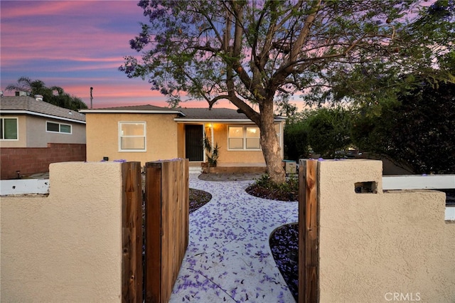 14124 Sayre St, Sylmar, CA 91342 - view of property exterior featuring a gate and stucco siding