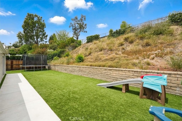 23021 Posada Dr, Valencia, CA 91354 - view of yard featuring a trampoline