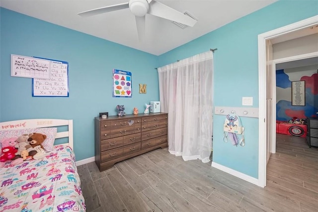 23021 Posada Dr, Valencia, CA 91354 - bedroom with wood finished floors, baseboards, and ceiling fan