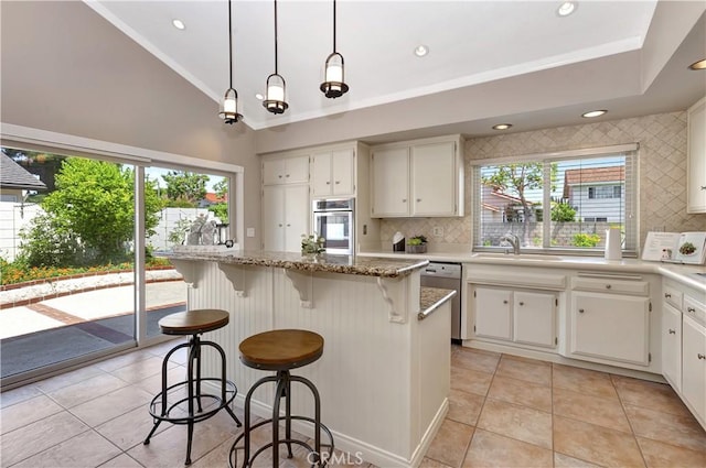 3531 Almond St, Irvine, CA 92606 - kitchen with stainless steel appliances, decorative backsplash, light tile patterned flooring, light stone countertops, and vaulted ceiling