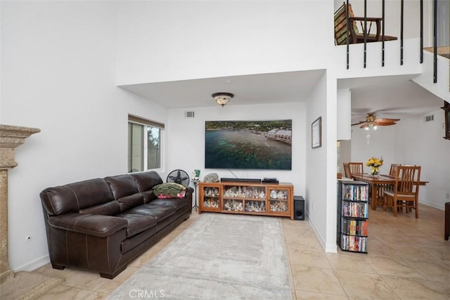 2922 Estancia, San Clemente, CA 92673 - living area with a high ceiling, light tile patterned floors, ceiling fan, and baseboards