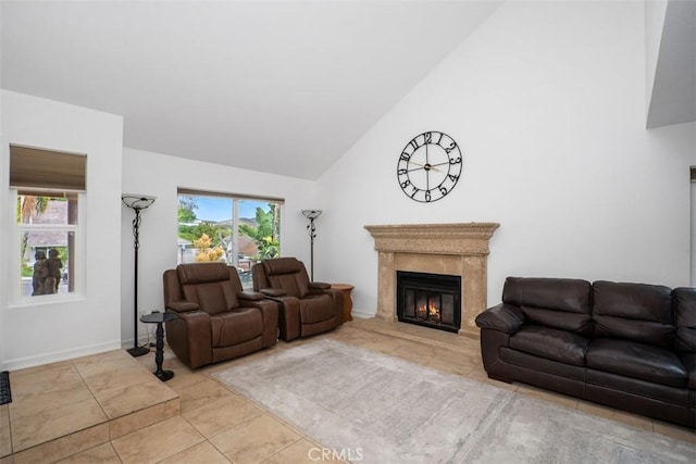 2922 Estancia, San Clemente, CA 92673 - living room featuring high vaulted ceiling, a high end fireplace, tile patterned floors, and baseboards