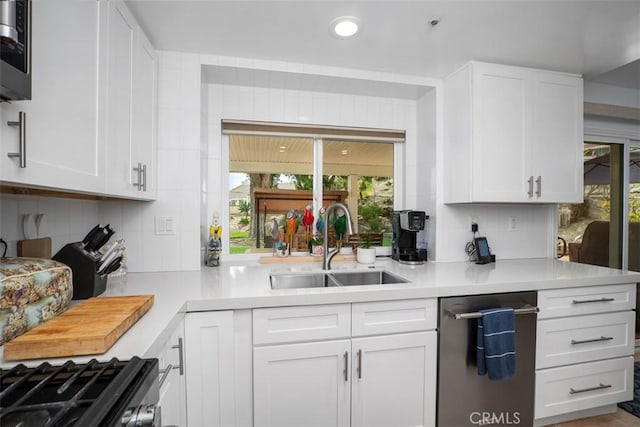 2922 Estancia, San Clemente, CA 92673 - kitchen featuring tasteful backsplash, a sink, light countertops, white cabinets, and recessed lighting