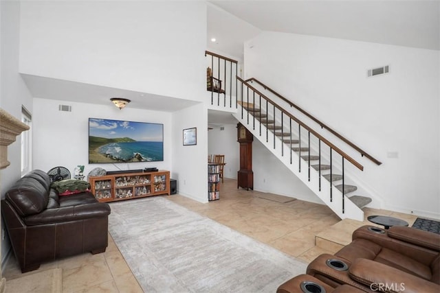 2922 Estancia, San Clemente, CA 92673 - living area with a towering ceiling, stairs, and baseboards