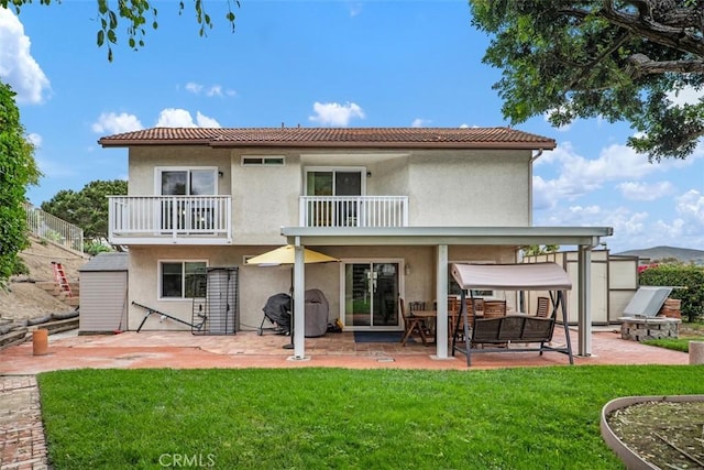 2922 Estancia, San Clemente, CA 92673 - back of property featuring a balcony, a patio area, stucco siding, and a yard