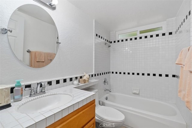 2922 Estancia, San Clemente, CA 92673 - full bath featuring washtub / shower combination, toilet, vanity, a textured wall, and backsplash