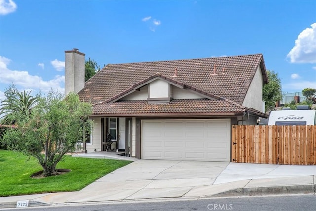 2922 Estancia, San Clemente, CA 92673 - view of front of property with a tile roof, a chimney, a garage, and concrete driveway