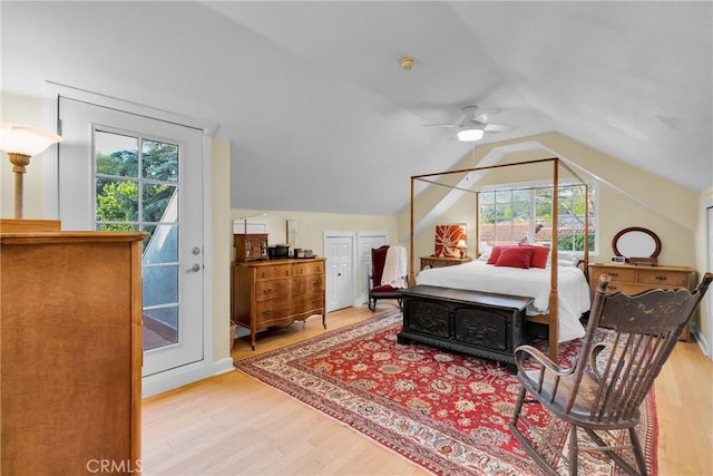 2309 E Glenoaks Blvd, Glendale, CA 91206 - bedroom with multiple windows, wood finished floors, access to outside, and vaulted ceiling