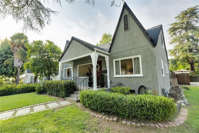 2309 E Glenoaks Blvd, Glendale, CA 91206 - bungalow with stucco siding, a front yard, and a porch