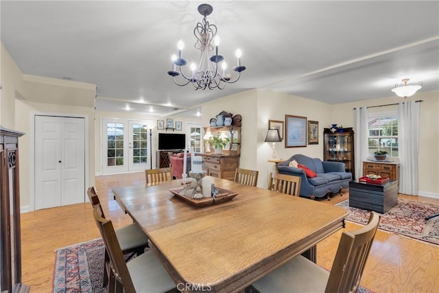 2309 E Glenoaks Blvd, Glendale, CA 91206 - dining room featuring light wood finished floors, plenty of natural light, a chandelier, and french doors