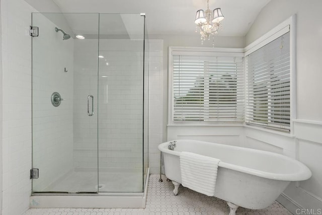 856 Oro Grande St, Oceanside, CA 92057 - bathroom with a shower stall, a freestanding tub, a chandelier, tile patterned flooring, and lofted ceiling