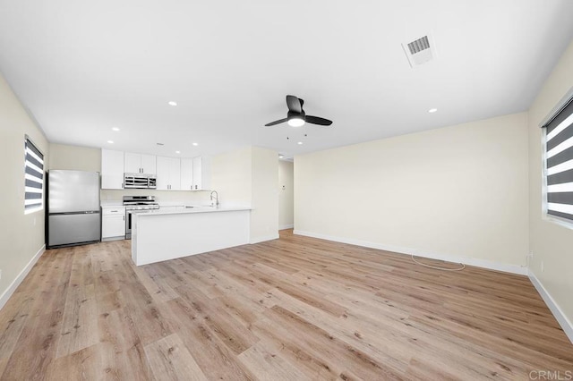 49694971-4973 N 72nd St, San Diego, CA 92115 - unfurnished living room with light wood finished floors, ceiling fan, baseboards, and recessed lighting