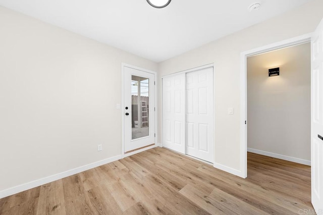 49694971-4973 N 72nd St, San Diego, CA 92115 - unfurnished bedroom with light wood finished floors, baseboards, and a closet