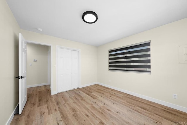 49694971-4973 N 72nd St, San Diego, CA 92115 - unfurnished bedroom with light wood finished floors, baseboards, and a closet