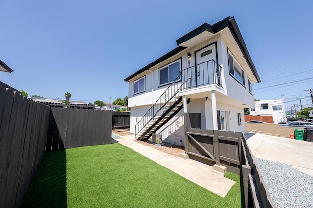 49694971-4973 N 72nd St, San Diego, CA 92115 - back of house with stucco siding, stairway, and concrete driveway