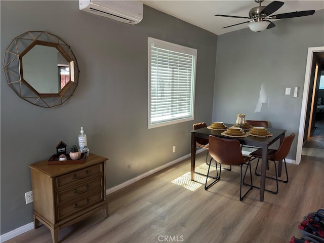 1735 Chestnut Ave, Long Beach, CA 90813 - dining area with an AC wall unit, ceiling fan, and light wood-type flooring