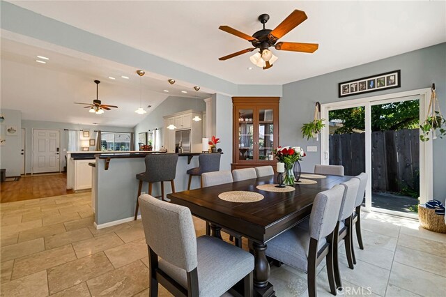 13 Avante Way, Chico, CA 95973 - dining area featuring a ceiling fan, vaulted ceiling, and baseboards