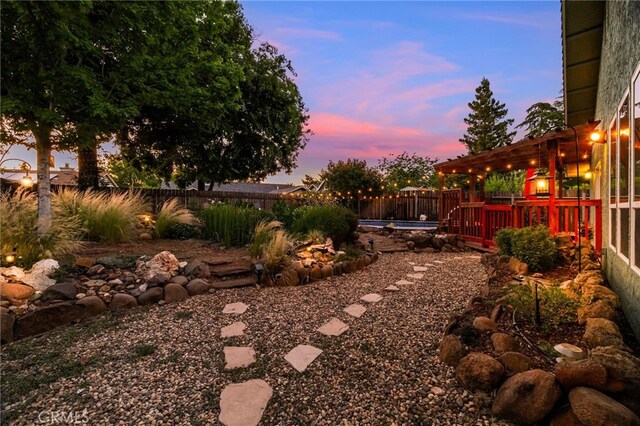 13 Avante Way, Chico, CA 95973 - yard at dusk with a fenced backyard and a swimming pool