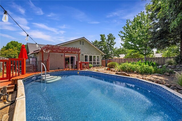 13 Avante Way, Chico, CA 95973 - view of swimming pool with a pergola, a fenced backyard, and a wooden deck