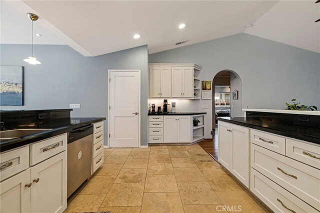 13 Avante Way, Chico, CA 95973 - kitchen with open shelves, stainless steel dishwasher, arched walkways, lofted ceiling, and dark countertops