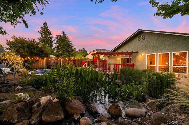 13 Avante Way, Chico, CA 95973 - yard at dusk with a deck