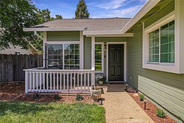 13 Avante Way, Chico, CA 95973 - doorway to property with a shingled roof and a porch