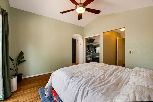 13 Avante Way, Chico, CA 95973 - bedroom with wood finished floors, vaulted ceiling, baseboards, arched walkways, and ceiling fan