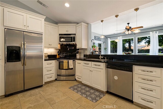 13 Avante Way, Chico, CA 95973 - kitchen featuring stainless steel appliances, a sink, dark countertops, vaulted ceiling, and ceiling fan