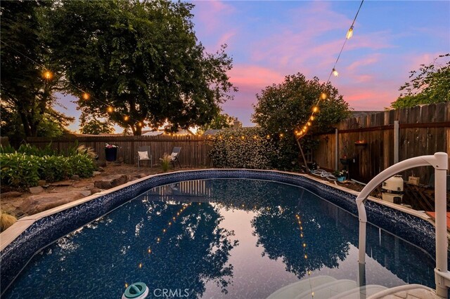 13 Avante Way, Chico, CA 95973 - pool at dusk with a fenced backyard