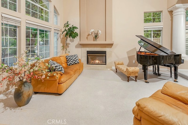 17910 Montague Ct, Granada Hills, CA 91344 - living room with a tiled fireplace, carpet, ornate columns, and baseboards