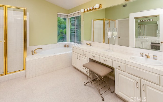 17910 Montague Ct, Granada Hills, CA 91344 - bathroom with double vanity, a shower stall, a garden tub, and vaulted ceiling