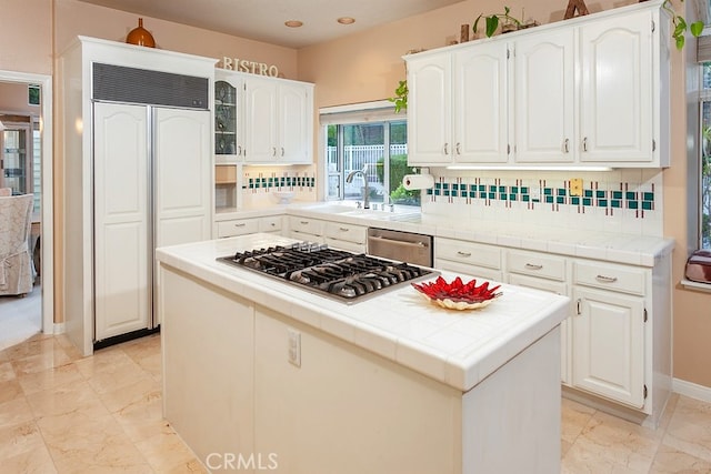 17910 Montague Ct, Granada Hills, CA 91344 - kitchen with appliances with stainless steel finishes, a sink, tile countertops, backsplash, and recessed lighting