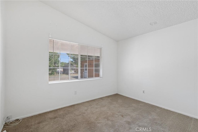 25360 Kuffel Rd, Menifee, CA 92585 - carpeted empty room with vaulted ceiling, a textured ceiling, and baseboards