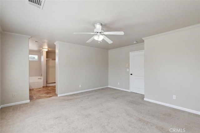 7538 N Erie Ave, Fresno, CA 93722 - spare room featuring ceiling fan, carpet floors, ornamental molding, and baseboards