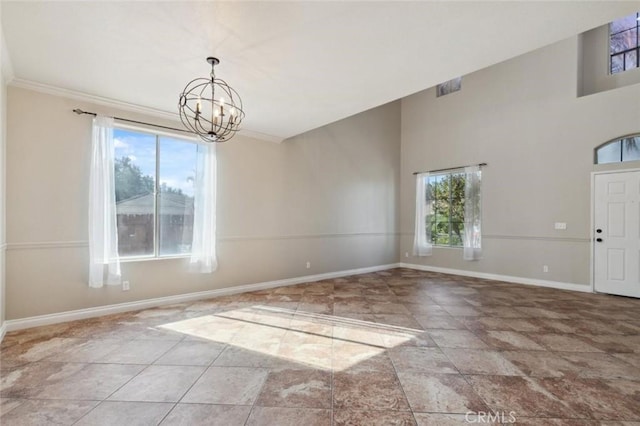 7538 N Erie Ave, Fresno, CA 93722 - unfurnished dining area featuring plenty of natural light, a chandelier, baseboards, and a high ceiling