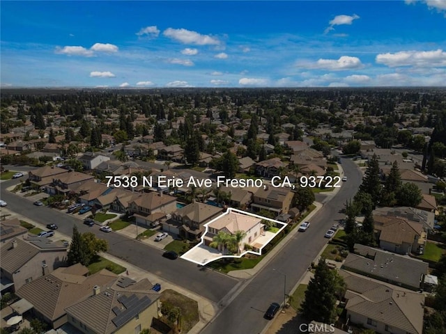 7538 N Erie Ave, Fresno, CA 93722 - aerial view of property and surrounding area with property boundaries highlighted and nearby suburban area