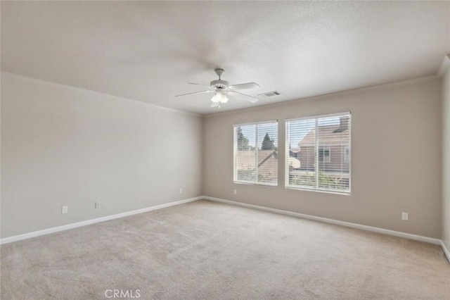7538 N Erie Ave, Fresno, CA 93722 - unfurnished room with ornamental molding, ceiling fan, light colored carpet, and baseboards