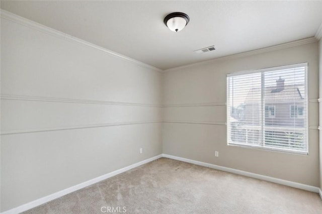 7538 N Erie Ave, Fresno, CA 93722 - empty room featuring baseboards, carpet floors, and crown molding