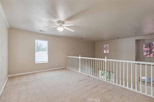 7538 N Erie Ave, Fresno, CA 93722 - unfurnished room featuring crown molding, a ceiling fan, carpet, and baseboards