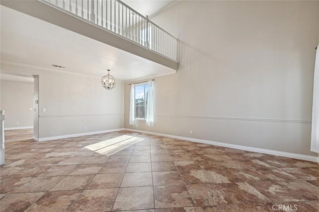 7538 N Erie Ave, Fresno, CA 93722 - tiled spare room featuring a chandelier and baseboards