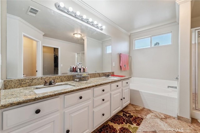7538 N Erie Ave, Fresno, CA 93722 - bathroom with a garden tub, double vanity, a stall shower, and ornamental molding