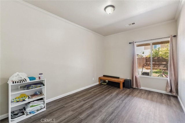 7538 N Erie Ave, Fresno, CA 93722 - unfurnished room featuring wood finished floors and ornamental molding