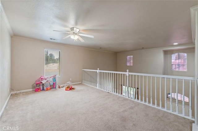 7538 N Erie Ave, Fresno, CA 93722 - playroom with a ceiling fan, carpet flooring, and ornamental molding